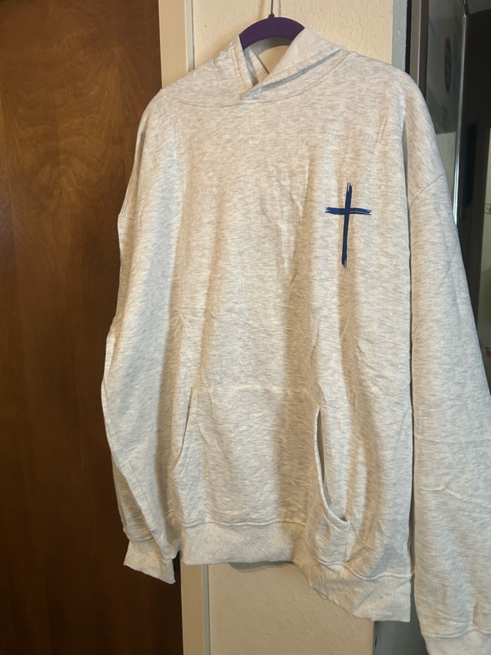 Light Gray Hooded Sweatshirt with Navy Cross Graphic